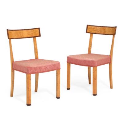 A pair of chairs in birch. “Shoes” on front legs and part of backrest in rosewood. Seat upholstered in pink fabric. Manufactured circa 1920–1930'erne. (2)