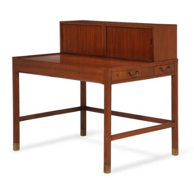Mahogany writing desk. Top with tambour door storage. Side with two drawers with brass handles. Made approx. 1940s. H. 73/101 cm. L. 103 cm. D. 75 cm.