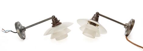 Poul Henningsen: "PH-1/1". A pair of browned brass wall lamps with frosted glass shades. (2)