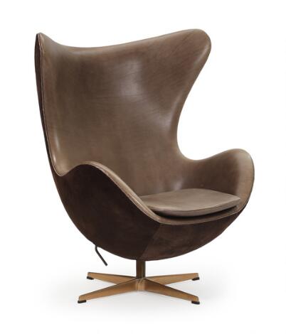 Arne Jacobsen: “The Golden Egg”. Easy chair with solid bronze frame, pholstered with chocolate brown suede and leather.