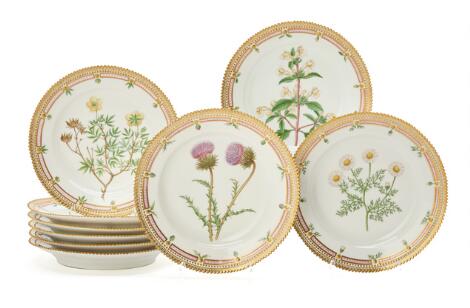Nine "Flora Danica" enamelled and gilt porcelain lunch plates. Royal Copenhagen. (9)