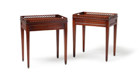 A pair of mahogany side tables, top with openwork carved edges. 20th century. H. 65 cm. L. 56 cm. W. 39 cm. (2)