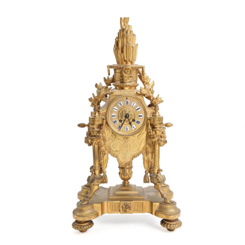 French console clock of gilded bronze, richly cast with foliage