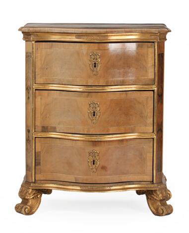 A Danish Rococo style walnut and giltwood commode. Late 19th century. H. 89 cm. W. 78 cm. D. 49 cm.