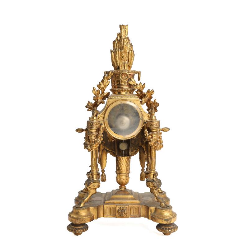 French console clock of gilded bronze, richly cast with foliage