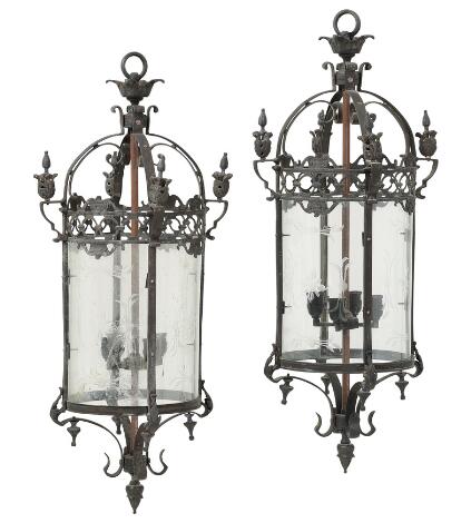 A pair of French wall lights in painted iron, curved sides with cut glass, internal electric lighting. 20th century. H. 102 cm. Diam. 43 cm. (2)