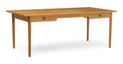 Hans J. Wegner: “PP 312”. A freestanding solid ash desk with two drawers in front.