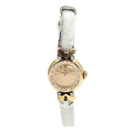 Omega: Diamond wristwatch of 18k gold, ref. 469247.12947. Mechanical movement with manual winding. Movement no. 17592492, cal. 483. 1959.