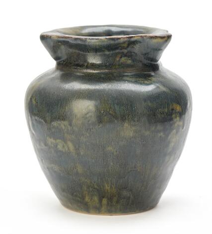 Royal Copenhagen: A stoneware vase modelled with a wavy rim. Decorated with green glaze. H. 17.5 cm.