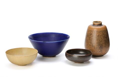 Saxbo: A collection of stoneware comprising three bowls and a vase. (4)