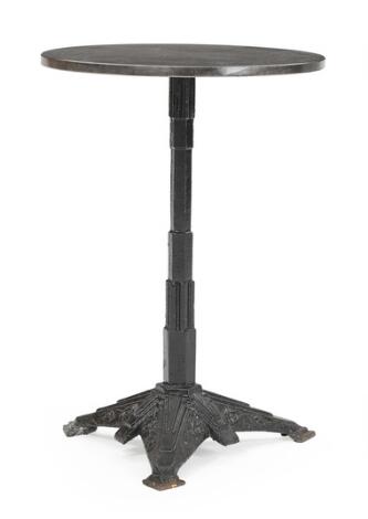Louis Vuitton: Art Deco bistro table of cast iron and black granite top. Manufactured by Louis Vuitton. H. 69. Diam. 47.5 cm.
