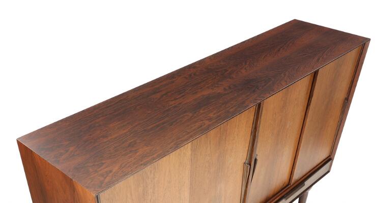 SOLD. Gunni Omann: A rosewood sideboard, front with two drawers and ...