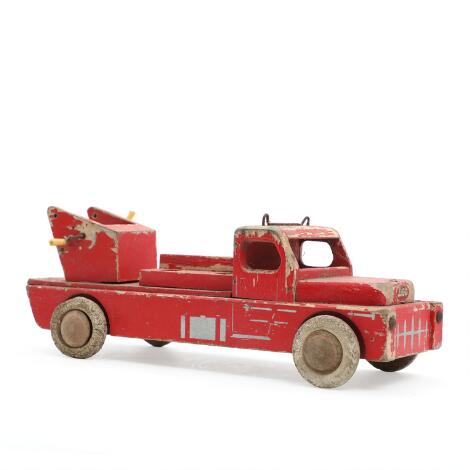 LEGO: A painted wooden firetruck. Manufactured and marked by LEGO. 1950s. L. 30 cm.