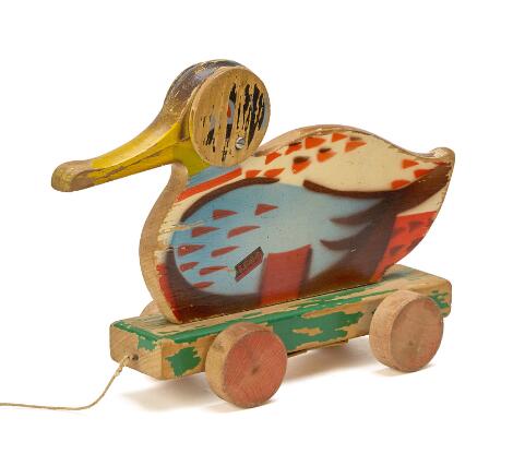 LEGO: Wooden jug made of painted wood on wheels with movable beak, marked “Lego, Billund Denmark”. L. 24 cm.