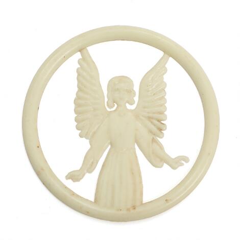 LEGO: Emblem of luminous plastic in the shape of an angel. 1950s. Diam. 5 cm.