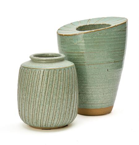 Thorvald Brix Isager: Two stoneware vases, modelled in relief, decorated with light blue-green glaze. (2)