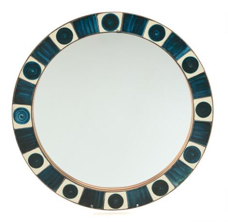 Dietlinde Hein: A circular wall mirror, the frame decorated with glazed ceramic tiles. Diam. 43 cm.