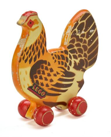 LEGO: Hen in painted wood, mounted on wheels. Manufactured by Lego and marked with label. H. 19 cm.