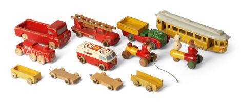 BILOfix a.o: A collection of painted wooden toys comprising a Hanse locomotive, Bilofix fire engine and various parts including a tram car and figures. (12)