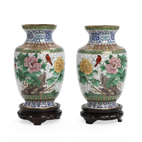 A pair of Chinese cloisonné vases, decorated with peonies and birds. 20th century. H. excl. stands 25.5 cm. (2)