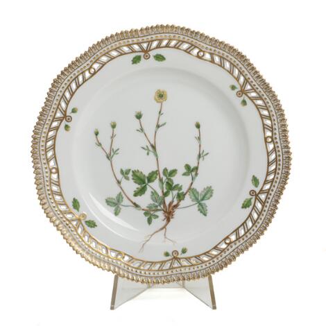 "Flora Danica". Luncheon plate of porcelain. Pierced rim. 3554. Royal Copenhagen. Diam. 23 cm.