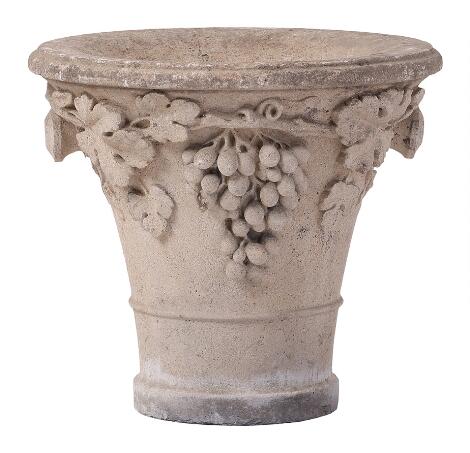 A garden vase in classical style cast in artificial stone with vine and foliage. 20th century. H. 50. Diam. 57.